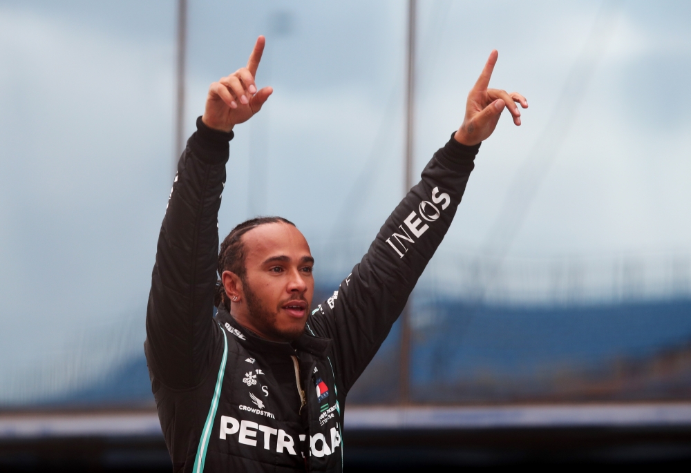 November 15, 2020 Mercedes' Lewis Hamilton celebrates after winning the race and the world championship REUTERS/Tolga Bozoglu