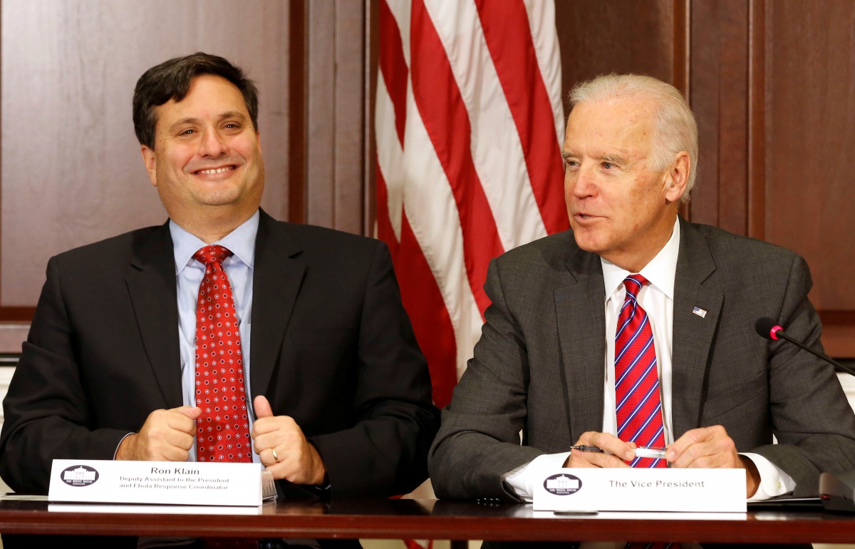 FILE PHOTO - U.S. Vice President Joe Biden (R) is joined by Ebola Response Coordinator Ron Klain (L) in the Eisenhower Executive Office Building on the White House complex in Washington, U.S. November 13, 2014. REUTERS/Larry Downing/File Picture
