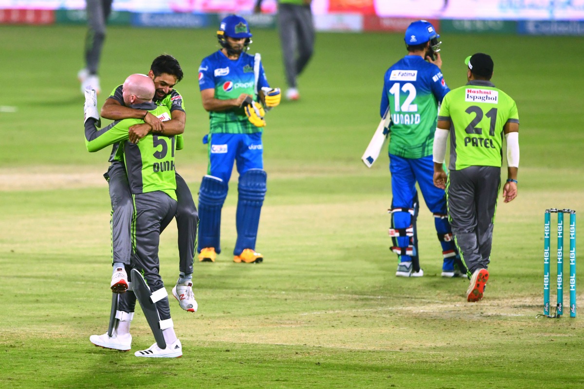 Lahore Qalandars’ cricketers celebrate after defeating Multan Sultans in their Pakistan Super League match at the National Stadium in Karachi, yesterday.