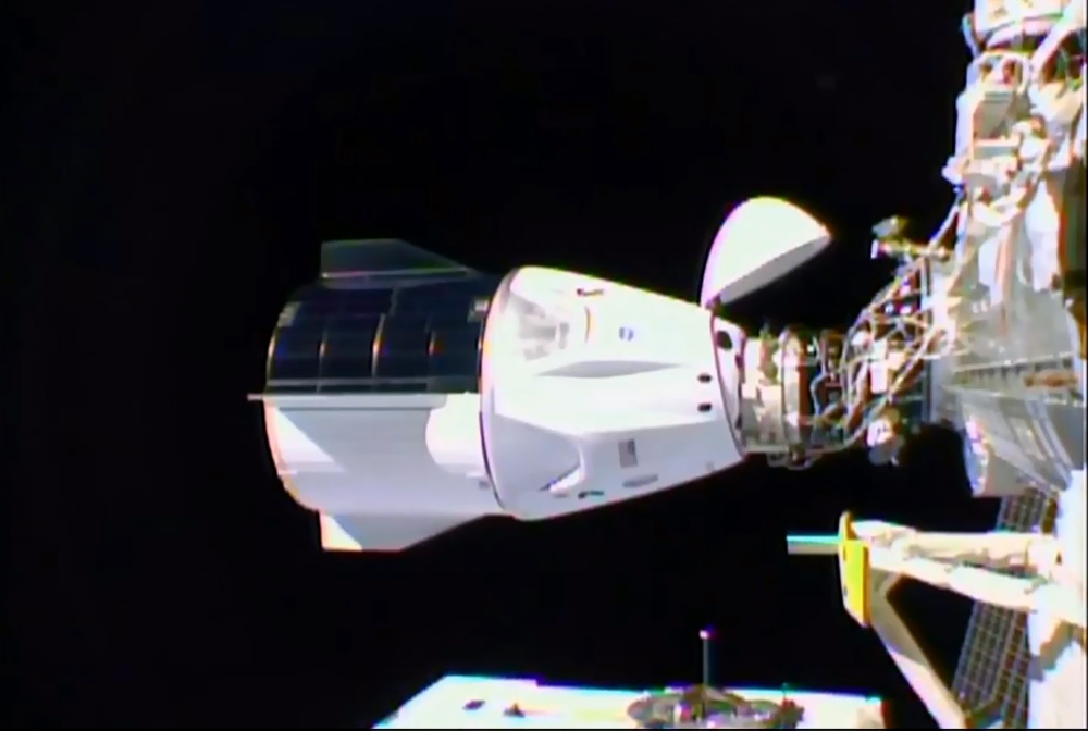 This NASA TV video grab shows Nasa's SpaceX Crew-1 mission aboard the SpaceX Crew Dragon (L) docked to the International Space Station (R) on November 16, 2020. Four astronauts were successfully launched on the SpaceX Crew Dragon 