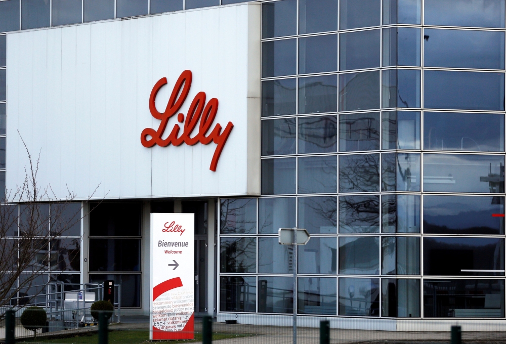 The logo of Lilly is seen on a wall of the Lilly France company unit, part of the Eli Lilly and Co drugmaker, in Fegersheim near Strasbourg, France, February 1, 2018. REUTERS/Vincent Kessler/File Photo