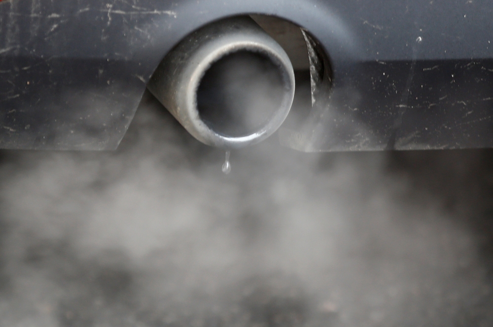 An exhaust emits fumes as a car is driven through Richmond in London, Britain December 2, 2016. REUTERS/Peter Nicholls/File Photo
