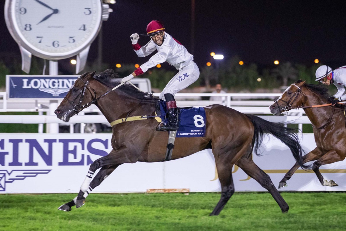 Alberto Sanna riding Perfect Empire celebrates the win at QREC's Al Rayyan Park yesterday. 