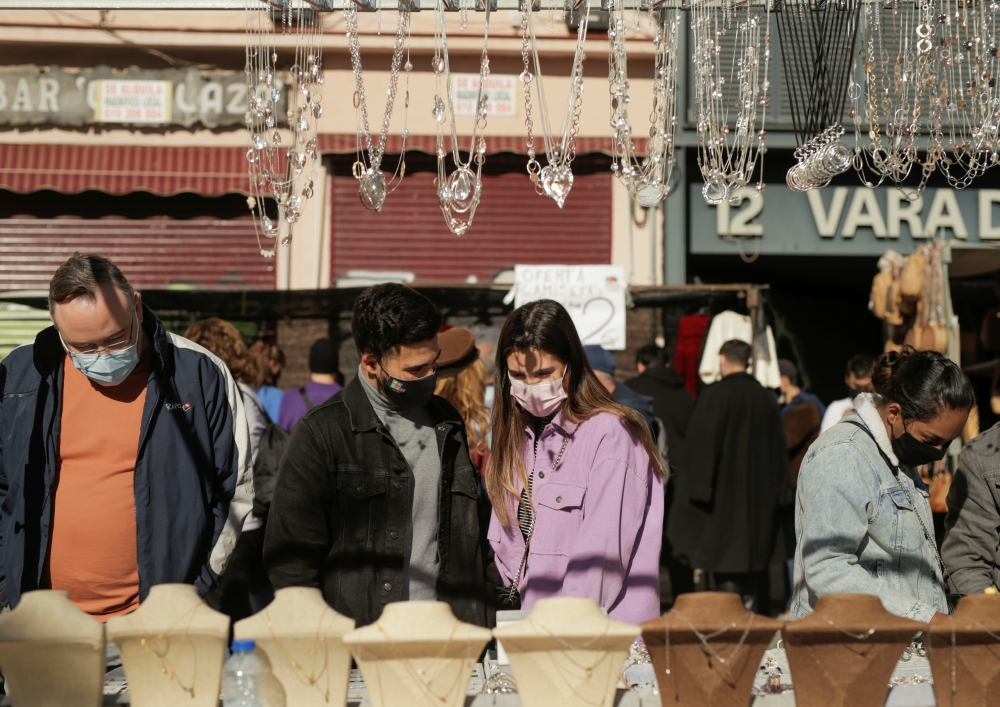 People shop at El Rastro flea market, amidst the coronavirus disease (COVID-19) outbreak in Madrid, Spain November 22, 2020. REUTERS/Javier Barbancho