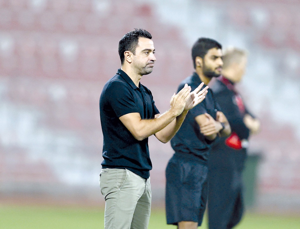Coach Xavi Hernandez applauds after Al Sadd won their QNB Stars League match against Al Arabi on Sunday.    