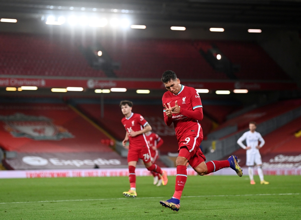 Liverpool's Roberto Firmino celebrates scoring their third goal Pool via REUTERS/Laurence Griffiths 