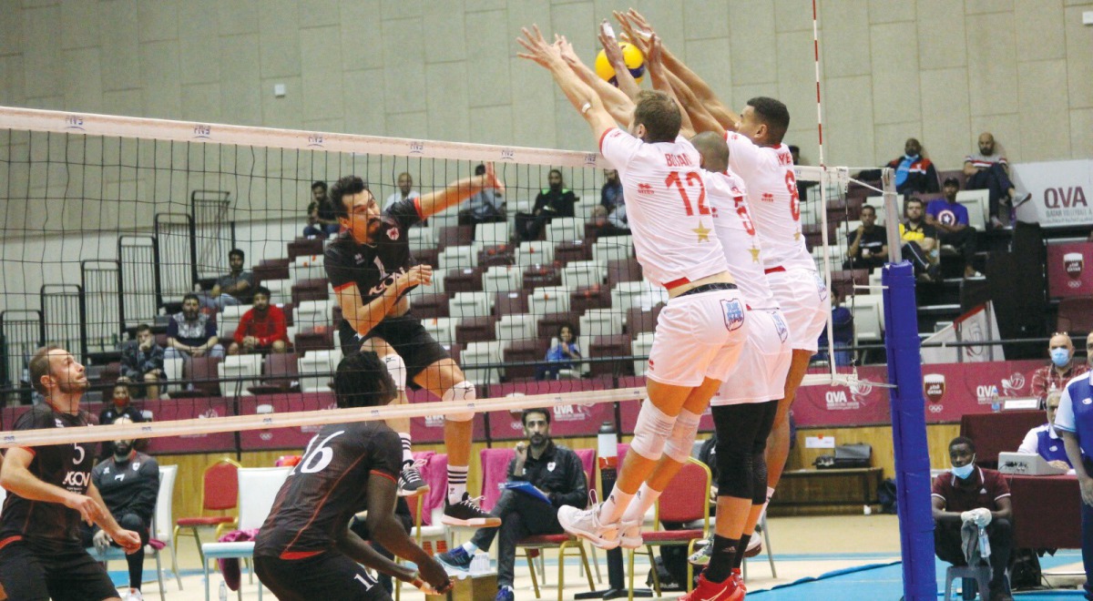 Al Arabi players blocking an attempt made by an Al Rayyan player during the second match of the day. Al Arabi beat Al Rayyan 3-2 with a 25-23, 20-25, 26-24, 22-25, 31-29 scoreline.