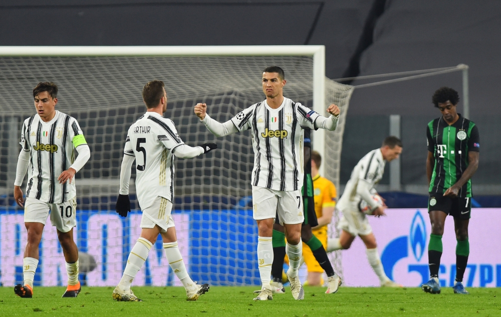 Soccer Football - Champions League - Group G - Juventus v Ferencvaros - Allianz Stadium, Turin, Italy - November 24, 2020 Juventus' Cristiano Ronaldo celebrates scoring their first goal with Arthur REUTERS/Massimo Pinca
