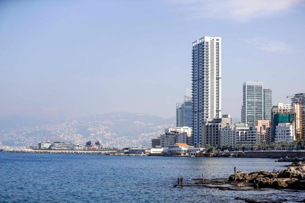 Lebanese fishermen are pictured near the promenade in the capital Beirut on November 24, 2020. / AFP / JOSEPH EID