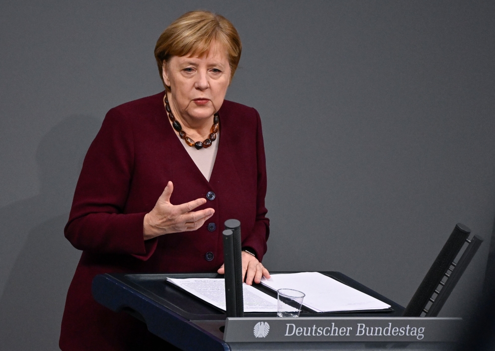 German Chancellor Angela Merkel delivers a speech during a session at the Bundestag (lower house of parliament) on November 26, 2020 in Berlin on measures to curb the spread of the novel coronavirus (COVID-19). / AFP / Tobias SCHWARZ