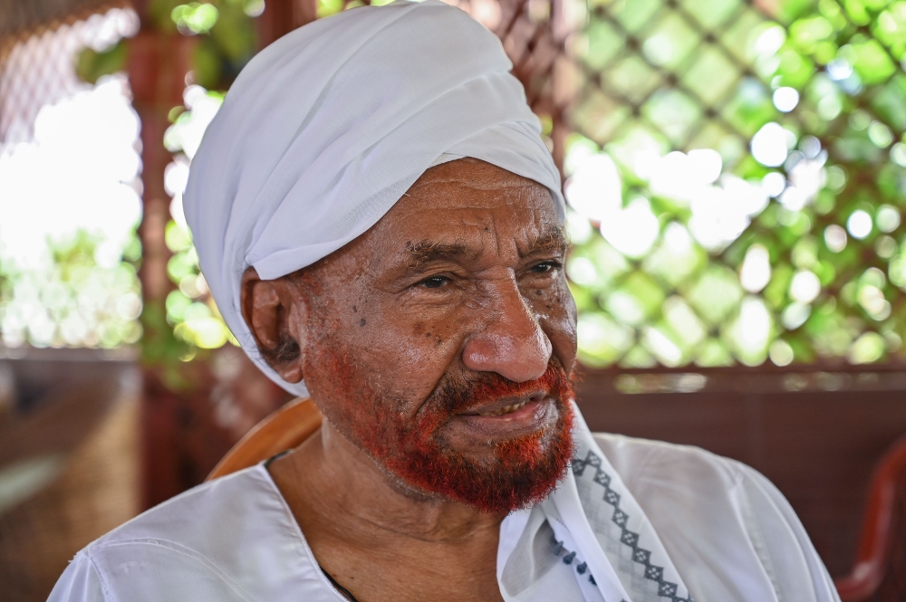 Sudan's top opposition leader and former prime minister Sadiq al-Mahdi, whose elected government was toppled in a 1989 Islamist-backed coup, speaks during an interview at his residence in Omdourman.  AFP / OZAN KOSE