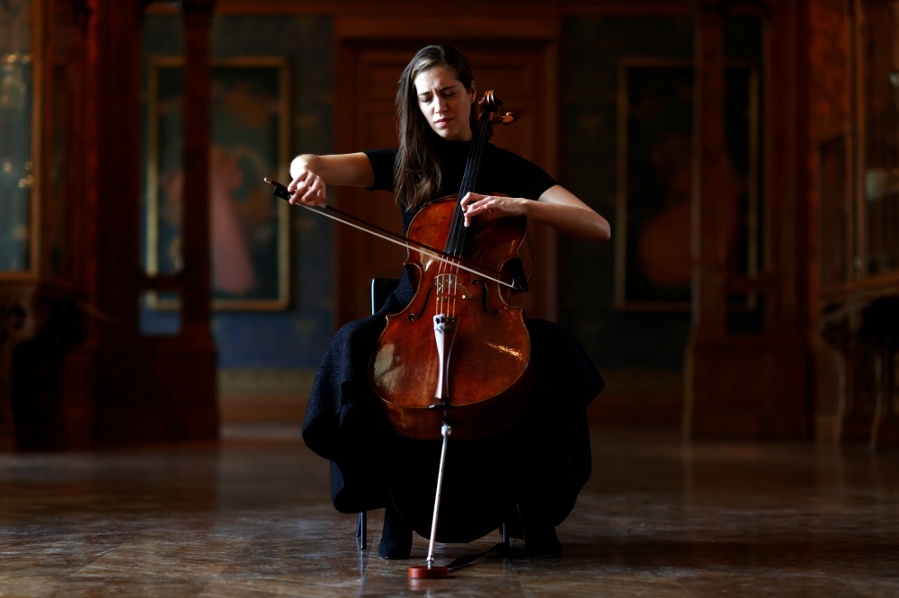 French-Belgian cellist Camille Thomas plays at the Musee des Arts Decoratifs, which is closed to visitors during the lockdown due to the spread of the coronavirus disease (COVID-19), in Paris, France, November 26, 2020. Picture taken November 26, 2020. RE