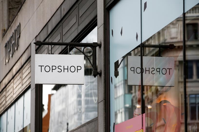 FILE PHOTO: Signage can be seen outside a Topshop and Topman store, owned by Arcadia Group, in central London, Britain June 5, 2019. REUTERS/Henry Nicholls