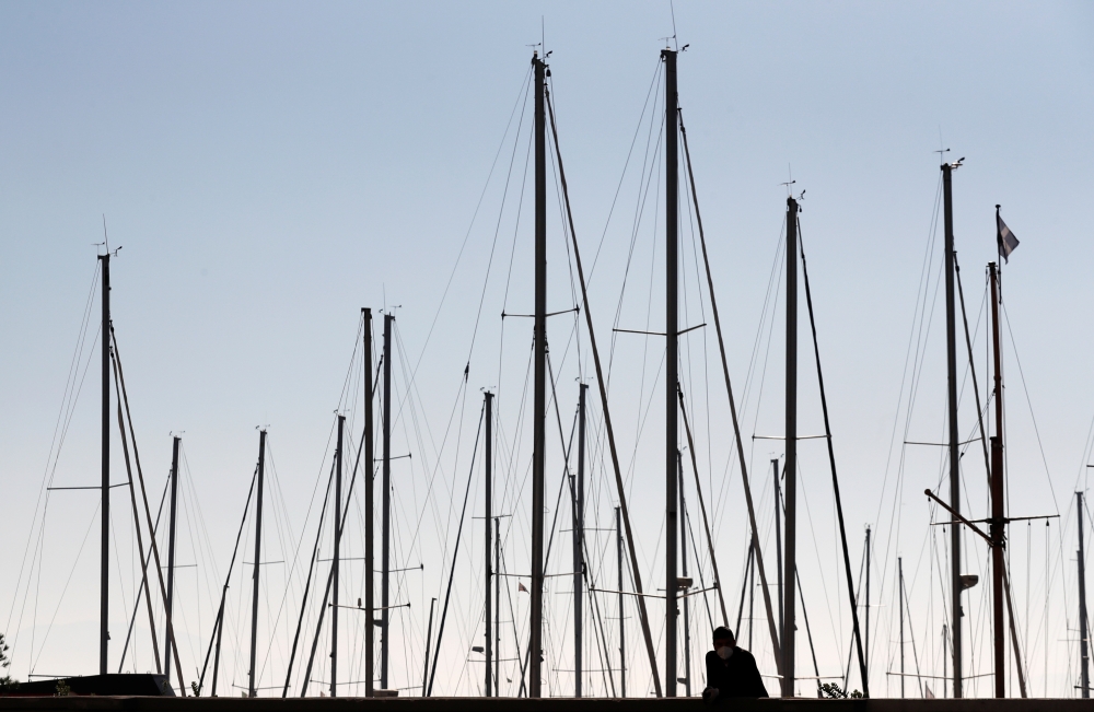 A man is seen on the waterfront as the spread of the coronavirus disease (COVID-19) continues, in Naples, Italy November 27, 2020. REUTERS/Yara Nardi