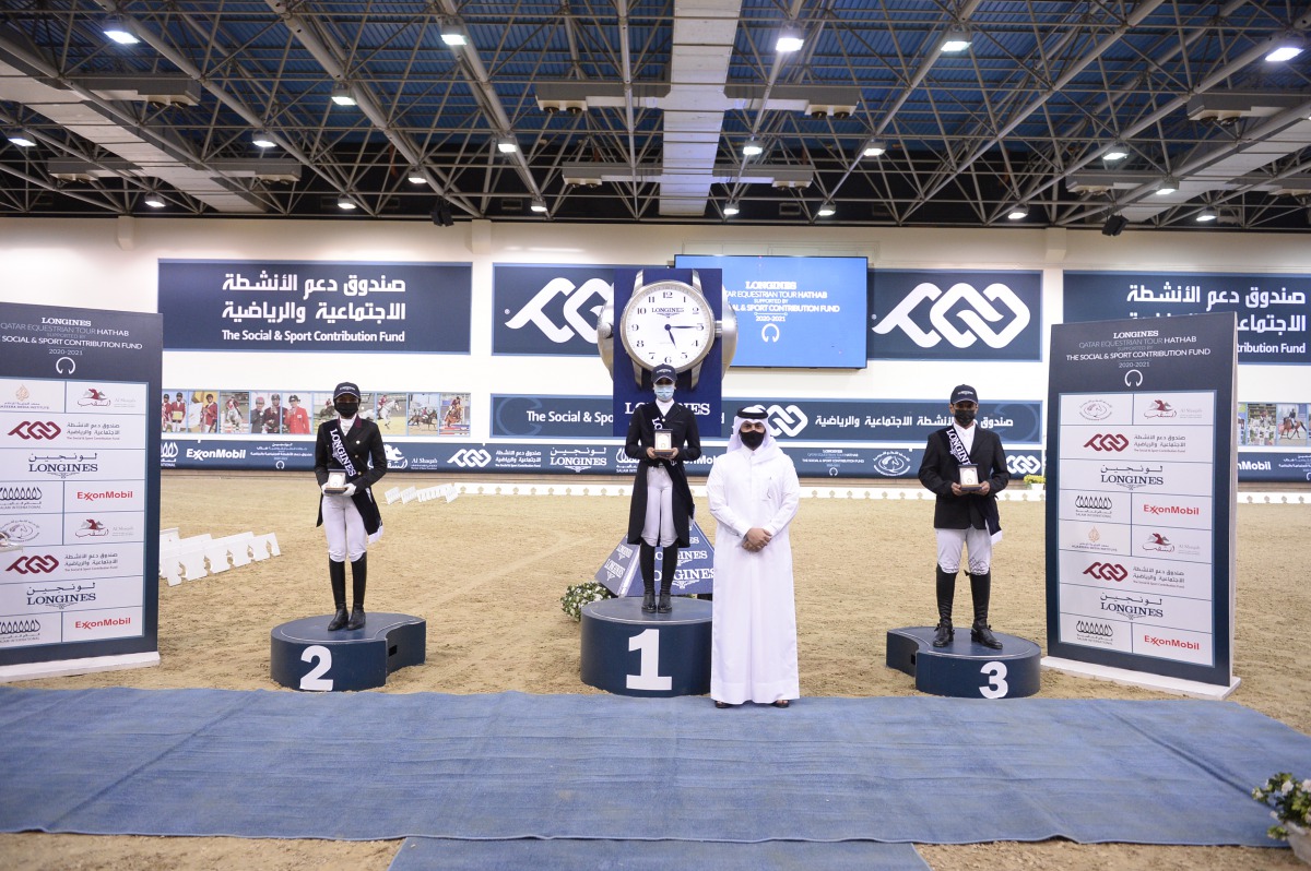 The podium winners of the Dressage - Medium (Level 1) event are seen during prize distribution ceremony at QEF's Indoor Arena yesterday.