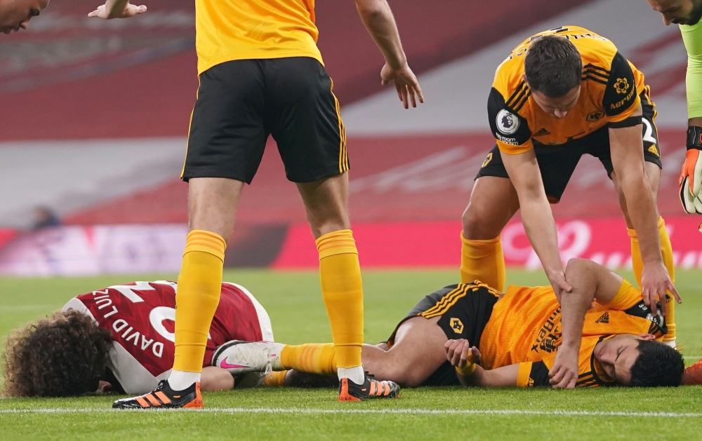 Arsenal's David Luiz and Wolverhampton Wanderers' Raul Jimenez after a head-on collision Pool via REUTERS/John Walton