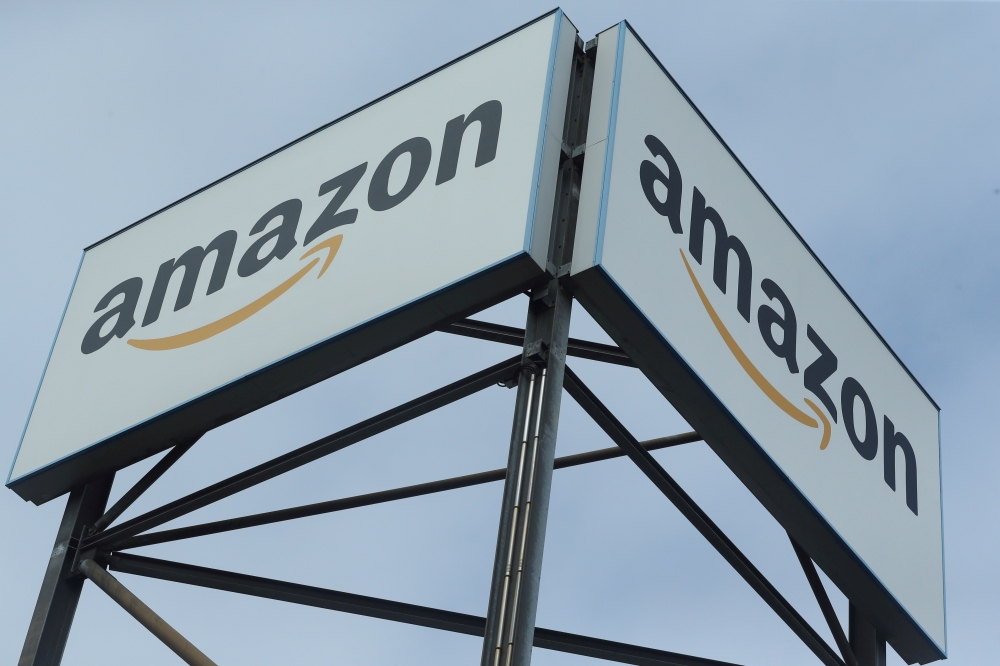 An Amazon logo is pictured at a logistics centre in Mannheim, Germany, September 17, 2019. REUTERS/Ralph Orlowski/File Photo