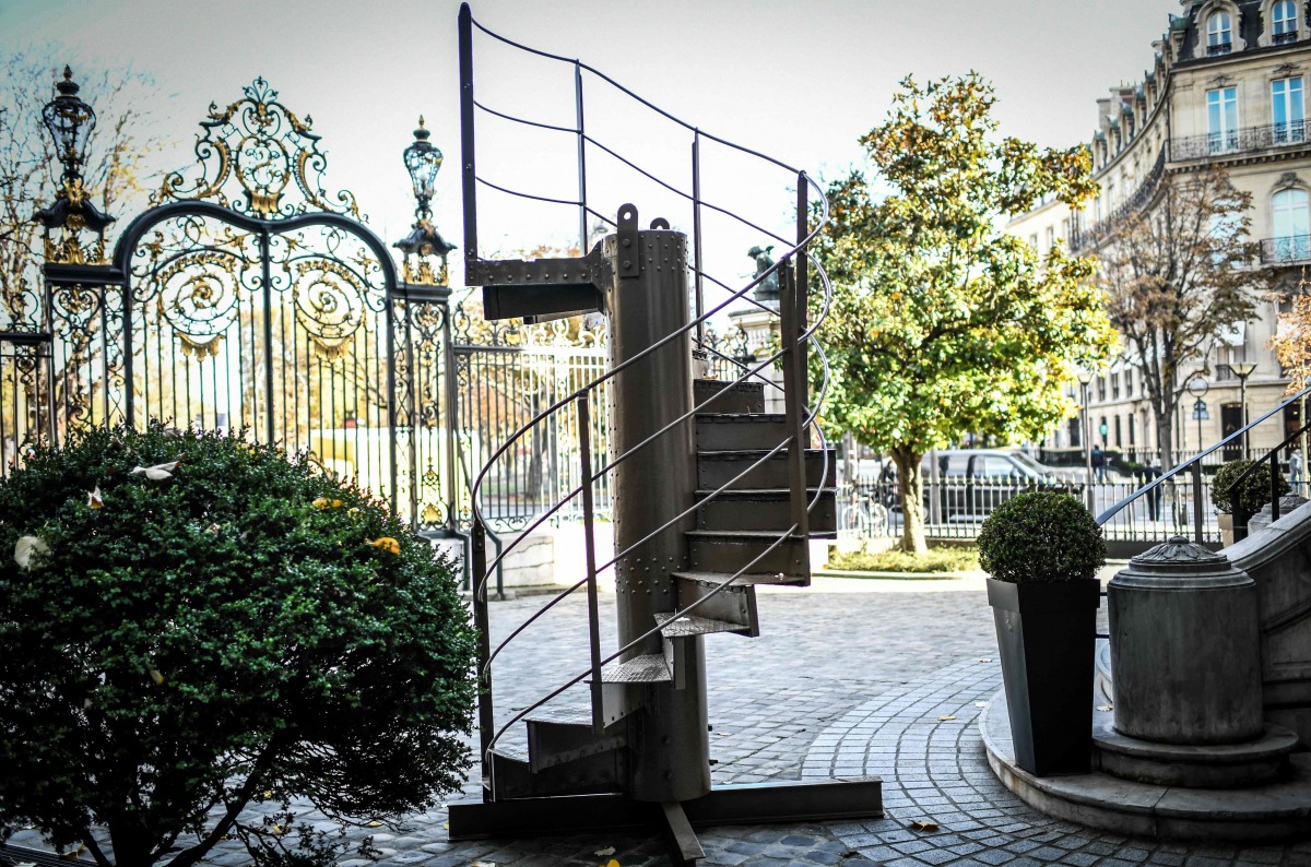 (FILES) This file photo taken on November 12, 2020, shows a section of the original Eiffel Tower's stairs, displayed in front of the Artcurial auction house in Paris.  / AFP / STEPHANE DE SAKUTIN