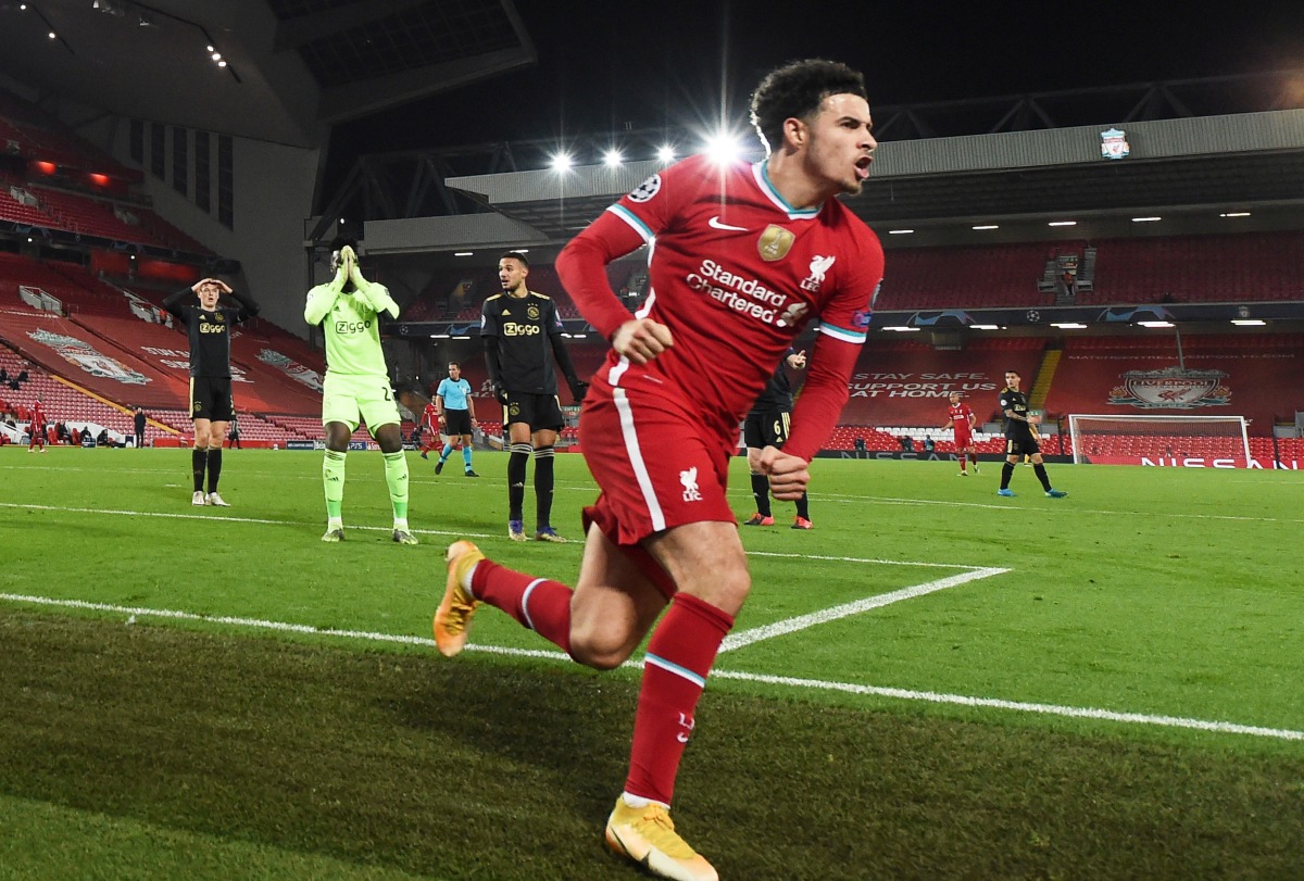 Soccer Football - Champions League - Group D - Liverpool v Ajax Amsterdam - Anfield, Liverpool, Britain - December 1, 2020 Liverpool's Curtis Jones celebrates scoring their first goal as Ajax's Andre Onana looks dejected Pool via REUTERS/Paul Ellis
