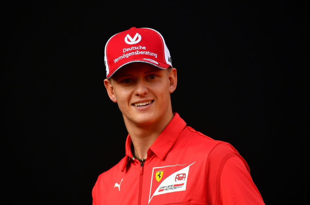 Racing driver Mick Schumacher attends an event to celebrate 90 years of Italian premium sports car maker Ferrari racing team at Milan's Duomo square, in Milan, Italy September 4, 2019. REUTERS/Flavio lo Scalzo/File Photo