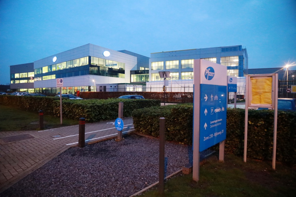 The Pfizer logo is seen at the entrance to Pfizer factory in Puurs, Belgium December 2, 2020. REUTERS/Bart Biesemans
