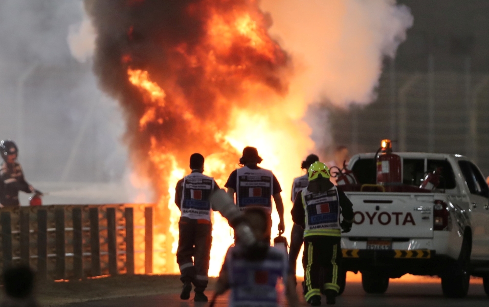 Flames seen from the crash scene after Haas' Romain Grosjean crashed out at the start of the race Pool via REUTERS/Kamran Jebreili/File Photo