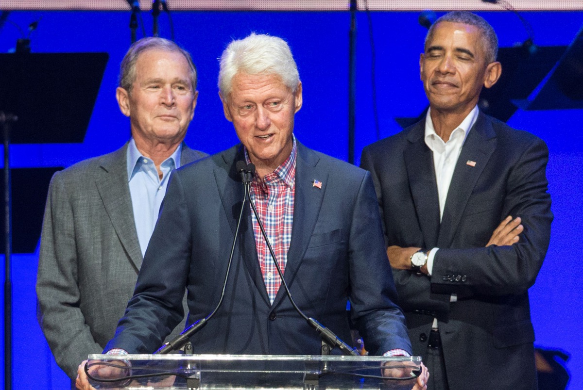 (FILES) In this file photo taken on October 21, 2017, (L-R) former US Presidents George W. Bush, Bill Clinton, and Barack Obama attend the Hurricane Relief concert in College Station, Texas. Obama, Bush and Bill Clinton are volunteering to take a coronavi