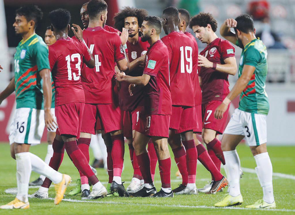 Qatar players celebrate after defeating Bangladesh 5-0 at Al Duhail Stadium on Friday.