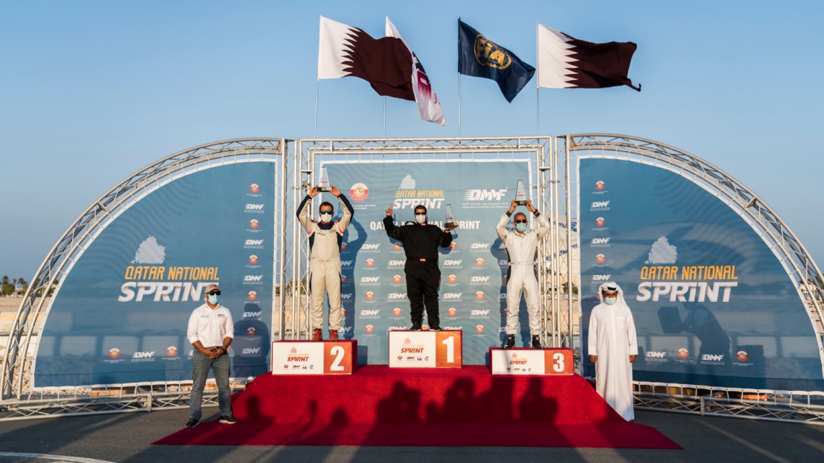 Qatar Motor and Motorcycle Federation (QMMF) President Abdulrahman Al Mannai and Executive Director Amro Al Hamad are seen with the overall winners of the Qatar National Sprint Championship. The fifth and final round of the season was held yesterday in Lo