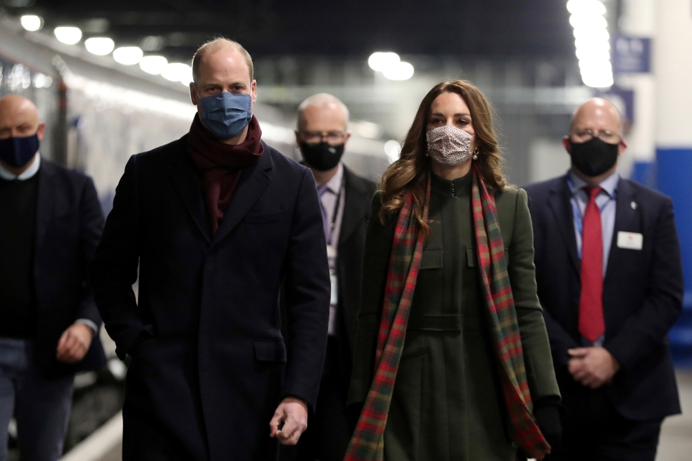 Britain's Prince William and Catherine, Duchess of Cambridge, board the Royal train at London Euston Station, as they embark on a three-day tour aboard the Royal train to thank frontline staff and community workers in the UK, in London, Britain, December 