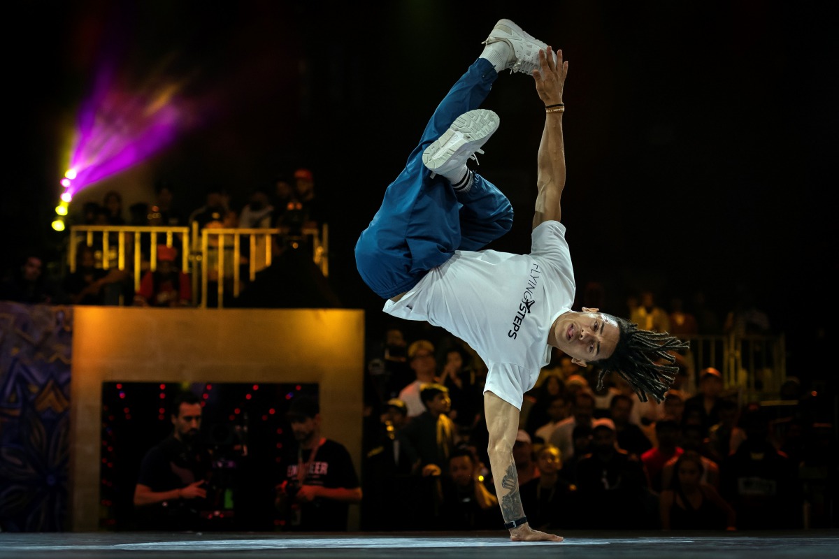 (FILES) In this file photo taken on November 9, 2019 Brazil's breakdancer Mateus de Sousa Melo aka Bart (white shirt) competes during the Red Bull BC One, the breakdance one-on-one battle world championship in Mumbai. The International Olympic Committee (
