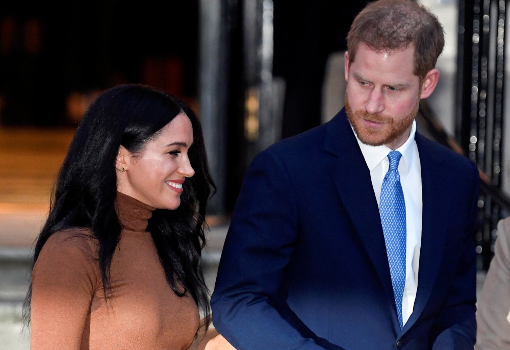 FILE PHOTO: Britain's Prince Harry and his wife Meghan, Duchess of Sussex, leave Canada House in London, Britain January 7, 2020. REUTERS/Toby Melville/File Photo
