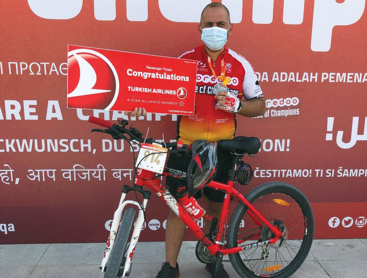 A victorious rider holding his ticket presented by Turkish Airlines.