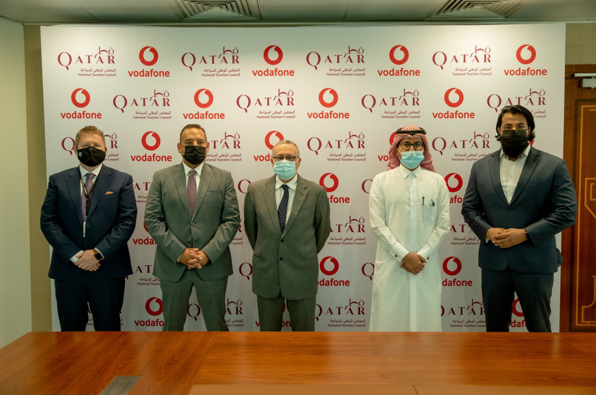 Qatar National Tourism Council COO Berthold Trenkel; Vodafone Qatar COO Diego Camberos and other officials at the MoU signing ceremony at QNTC headquarters yesterday.