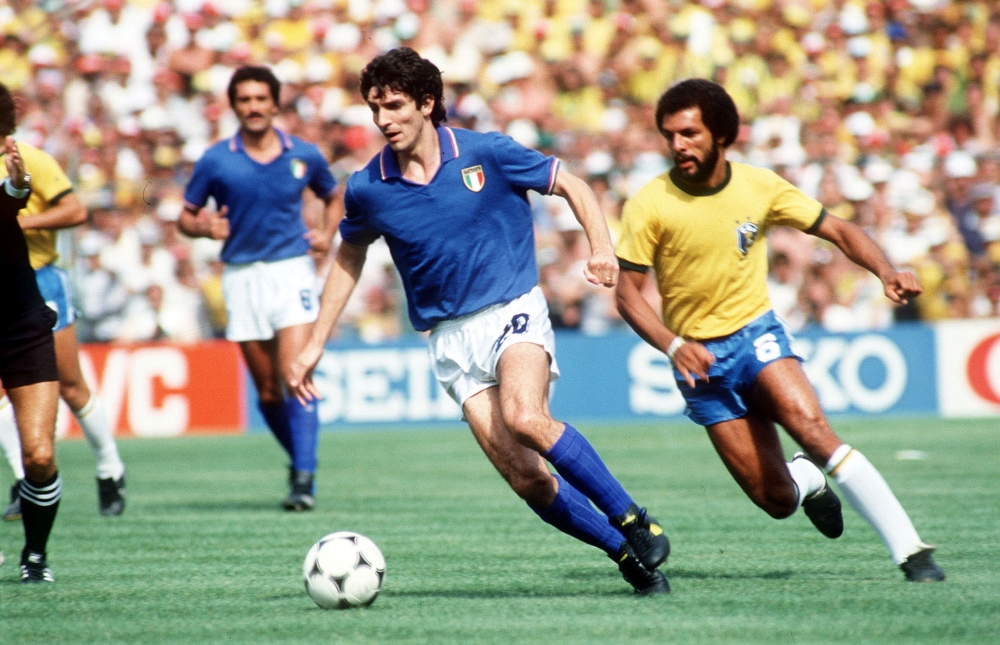 FILE PHOTO: Italy's Paolo Rossi gets away from Brazil's Junior.
