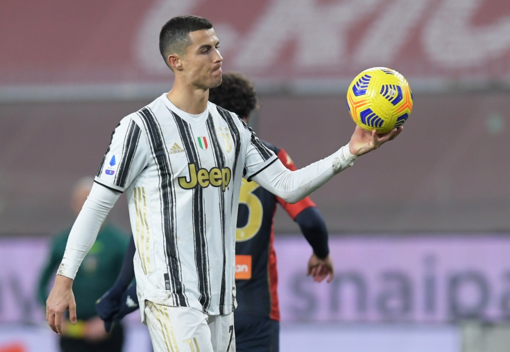 Juventus' Cristiano Ronaldo holding the ball after the match REUTERS/Jennifer Lorenzini