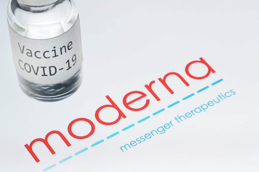 In this file photo taken on November 18, 2020 shows a syringe and a bottle reading 