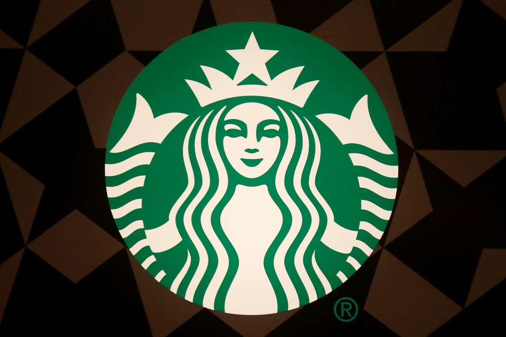 A Starbucks logo is pictured on the door of the Green Apron Delivery Service at the Empire State Building in the Manhattan borough of New York, U.S. June 1, 2016. REUTERS/Carlo Allegri/File Photo