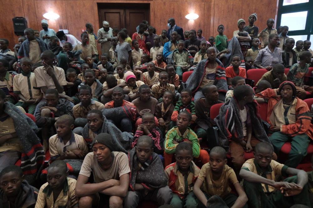 Released students gather at the Government House with other students from the Government Science Secondary school, in Kankara, in northwestern Katsina State, Nigeria upon their release on December 18, 2020. AFP / Kola Sulaimon 