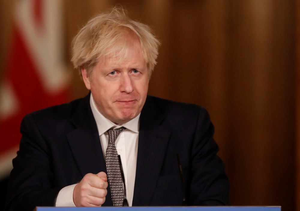 Britain's Prime Minister Boris Johnson speaks during a news conference about the ongoing situation with the coronavirus disease (COVID-19) pandemic, inside 10 Downing Street, in London, Britain, December 16, 2020. Matt Dunham/Pool via REUTERS