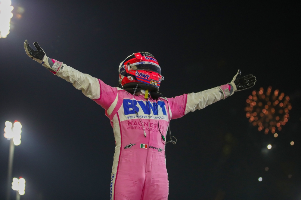 In this file photograph taken on December 6, 2020, Racing Point's Mexican driver Sergio Perez celebrates winning the Sakhir Formula One Grand Prix at the Bahrain International Circuit in the city of Sakhir. Mexican driver Sergio Perez will replace Alexand