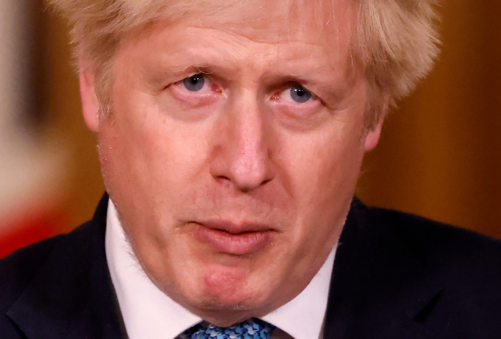 Britain's Prime Minister Boris Johnson speaks during a virtual press conference inside 10 Downing Street in central London on December 21, 2020, after a string of countries banned travellers and all but unaccompanied freight arriving from the UK, due to t