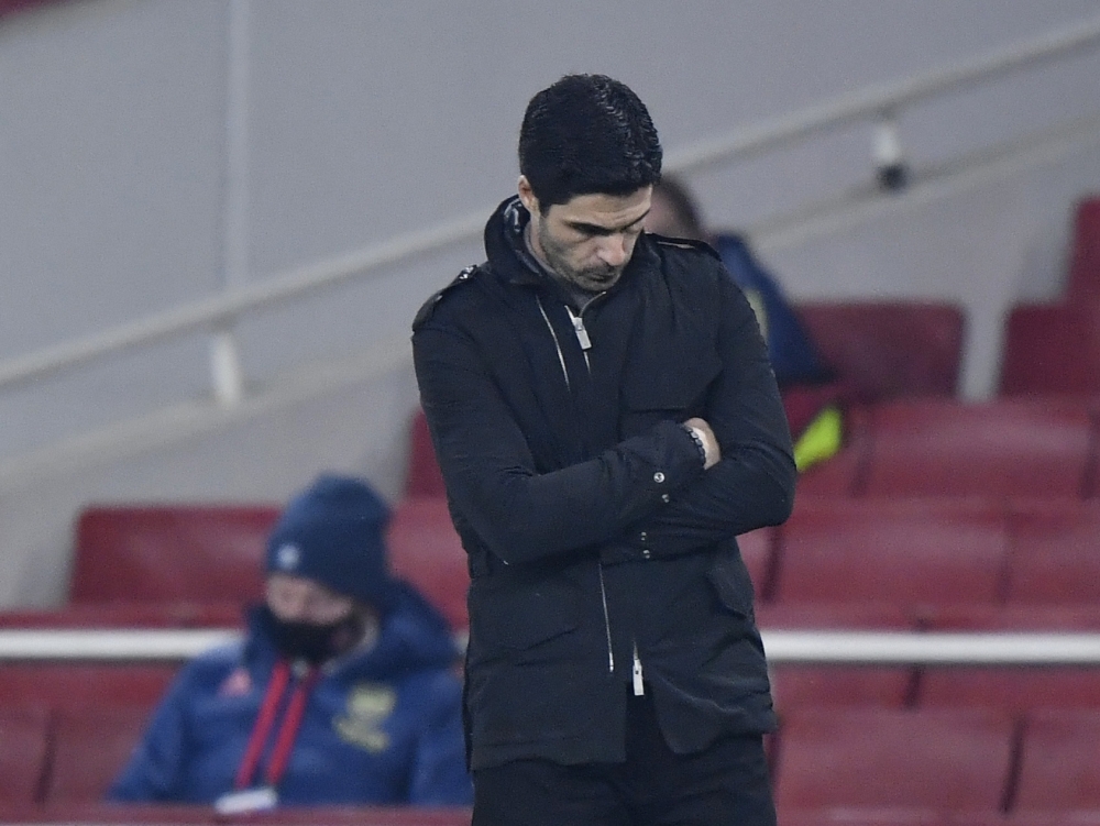 Arsenal manager Mikel Arteta looks dejected after Aymeric Laporte scored Manchester City's fourth goal REUTERS/Toby Melville 