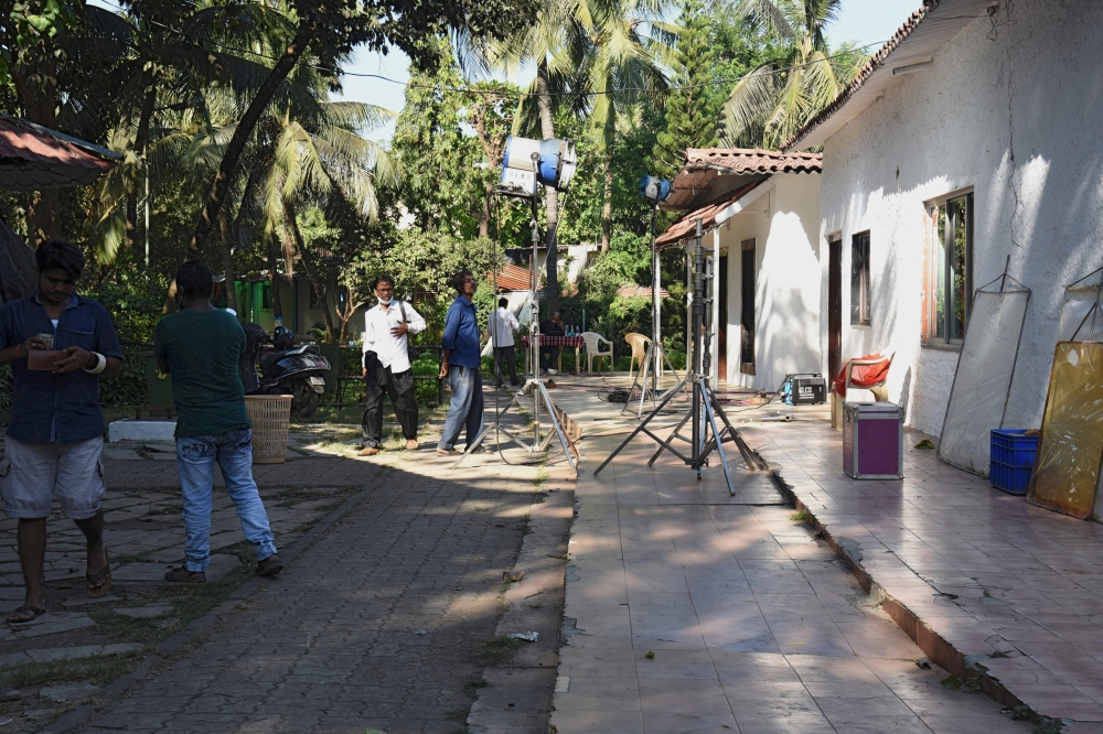 In this photograph taken on November 21, 2020, a lighting crew works on a Bollywood film set on Madh Island off the coast of Mumbai. AFP / Sujit Jaiswal 