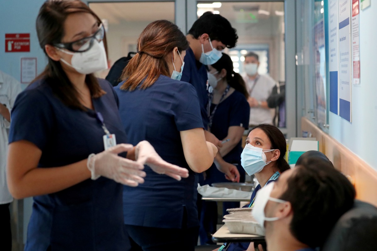 Healthcare workers prepare to receive the Pfizer/BioNtech vaccine against the coronavirus disease (COVID-19) at the Posta Central hospital in Santiago, Chile December 24, 2020. REUTERS/Ivan Alvarado
