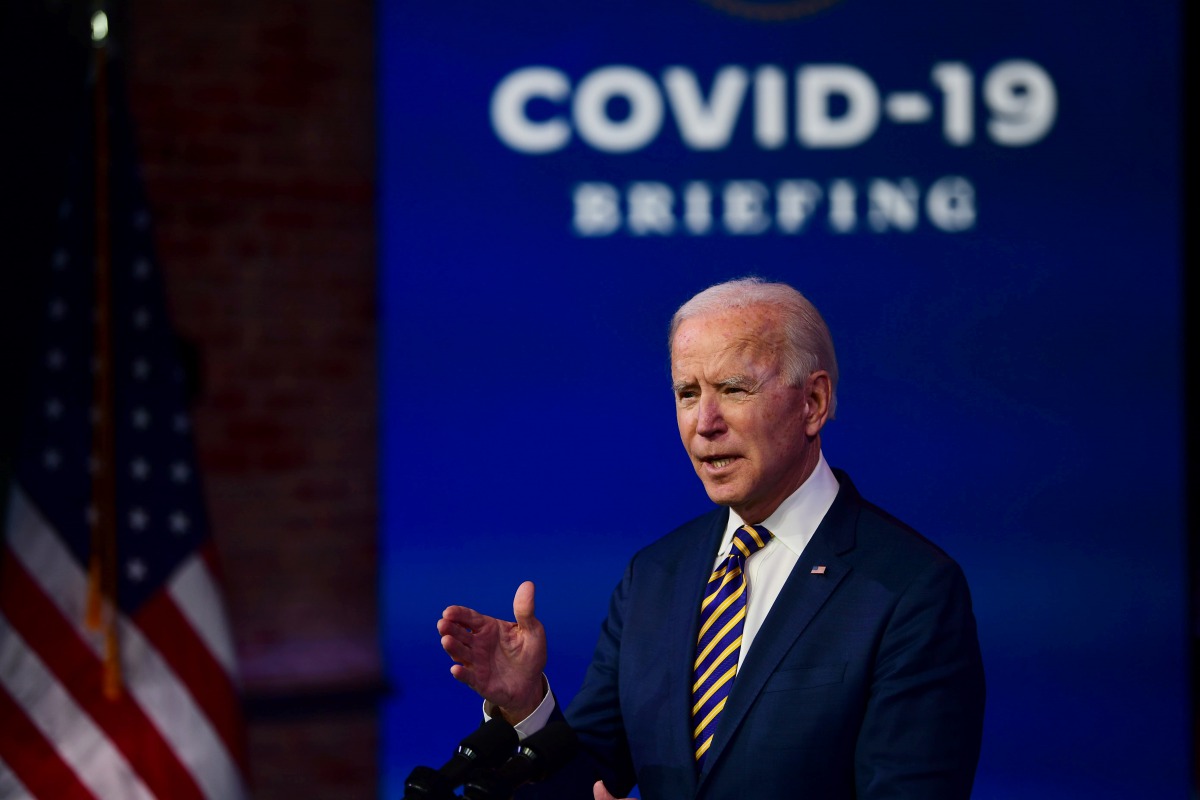 WILMINGTON, DE - DECEMBER 29: U.S. President-elect Joe Biden delivers remarks on the ongoing coronavirus (COVID-19) pandemic at the Queen Theater on December 29, 2020 in Wilmington, Delaware. Biden will be inaugurated as the 46th president in a scaled-dow
