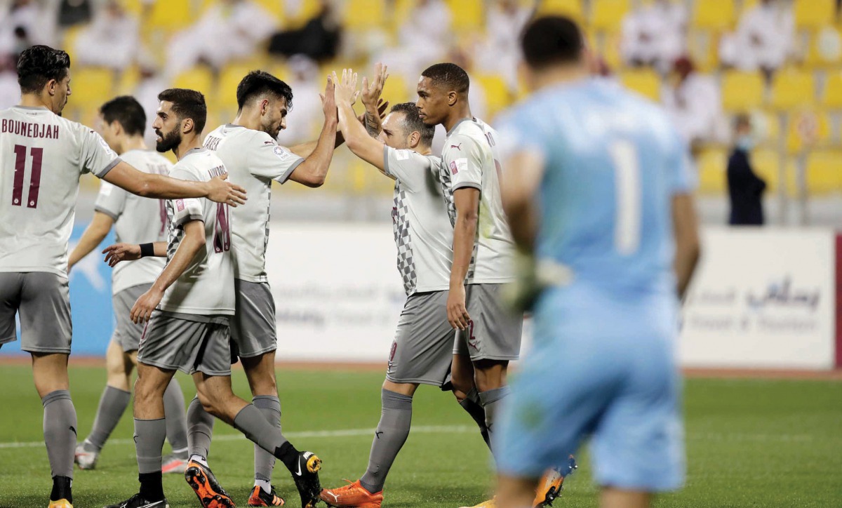 Al Sadd's players react after their Round 11 QSL match against Qatar SC on Monday.