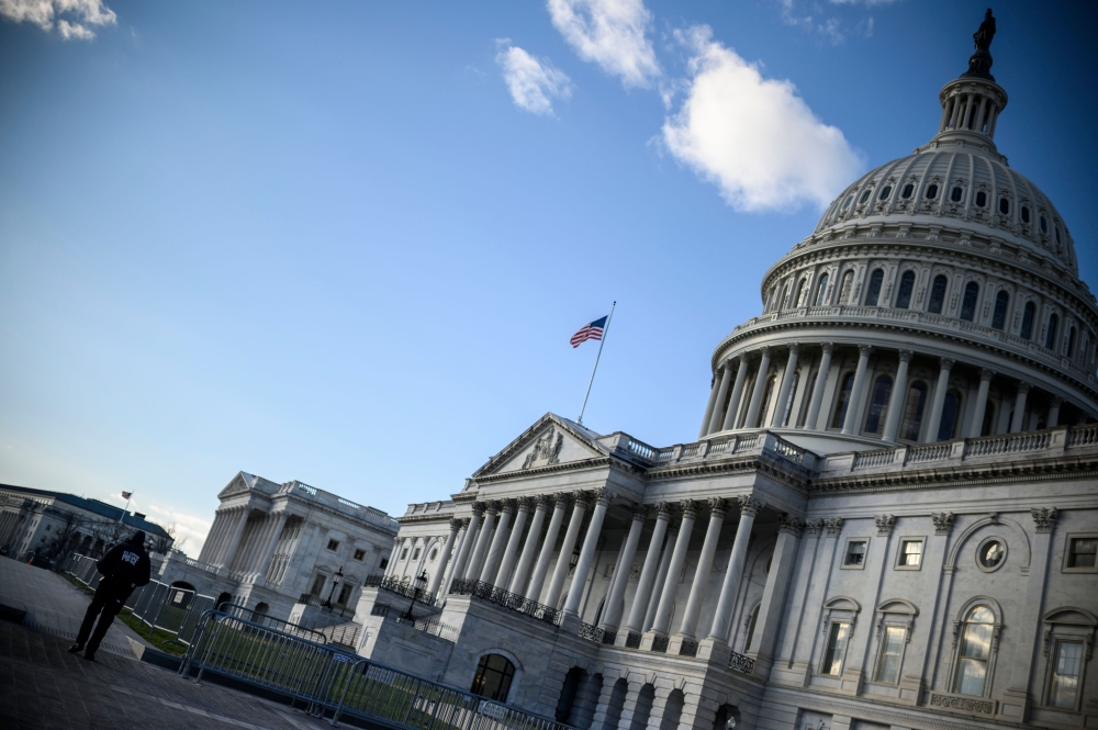 The US Capitol building is seen on a cold and sunny winter day as Congress is in session in Washington on December 29, 2020.  AFP / Eric BARADAT
