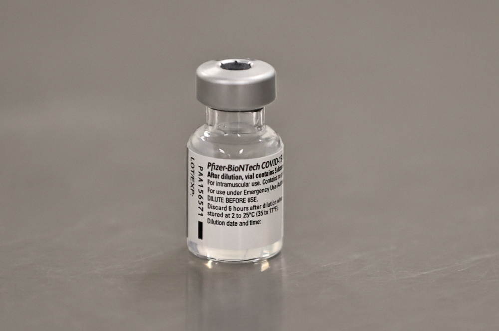 A vial of the Pfizer/BioNTech COVID-19 vaccine. Liam McBurney/Pool via Reuters  