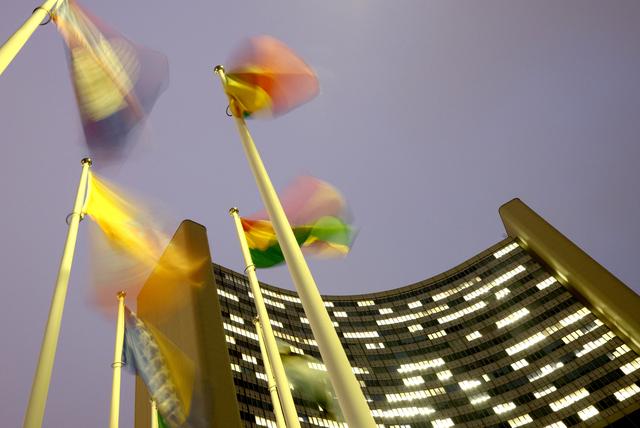 Flags flutter in the wind in front of the headquarters of the International Atomic Energy Agency (IAEA) in Vienna, Austria, December 16, 2020. Reuters/Lisi Niesner
